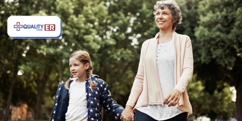 grandma walking outdoors with her grandaughter